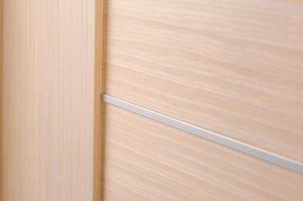 Maximum 201 Interior Door In A Bleach Oak Finish W/ Aluminum Strips